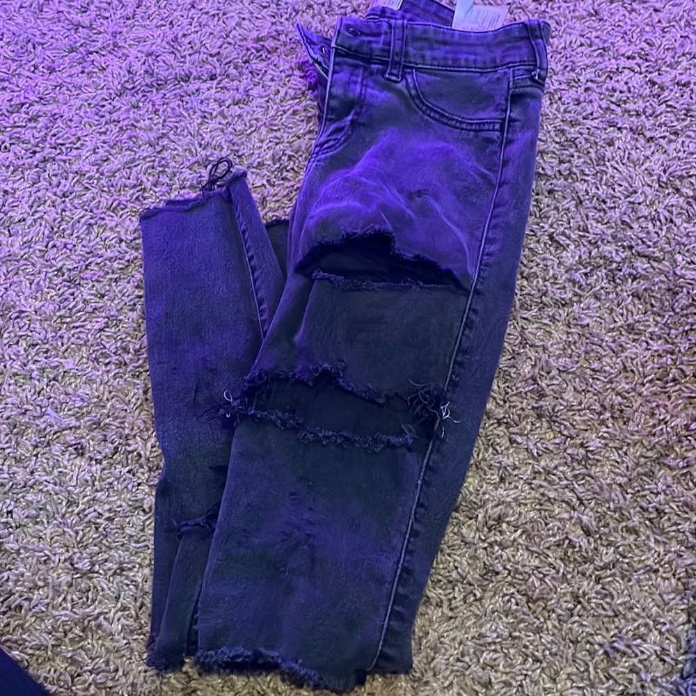 black jeans with holes